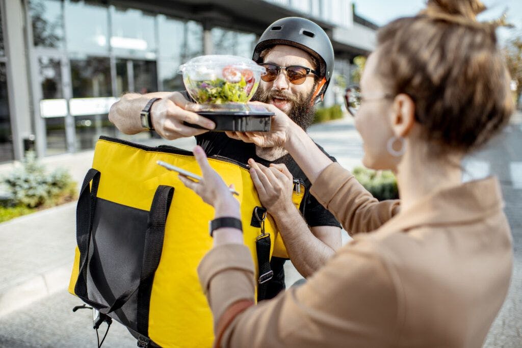Man and woman with food delivery.