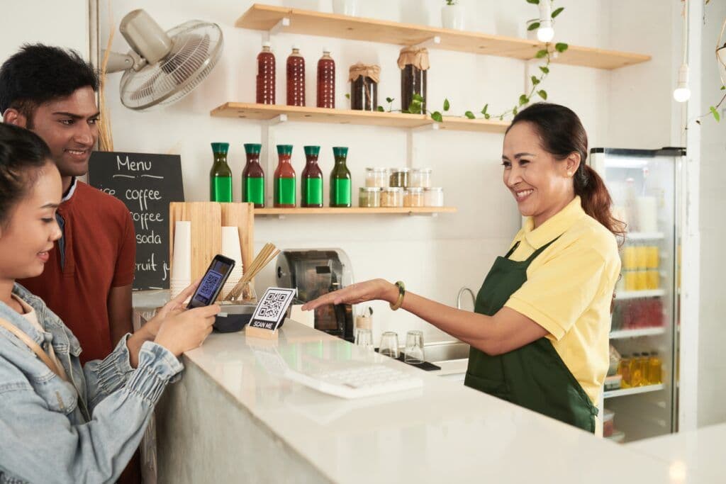 A woman effortlessly completes a payment transaction.