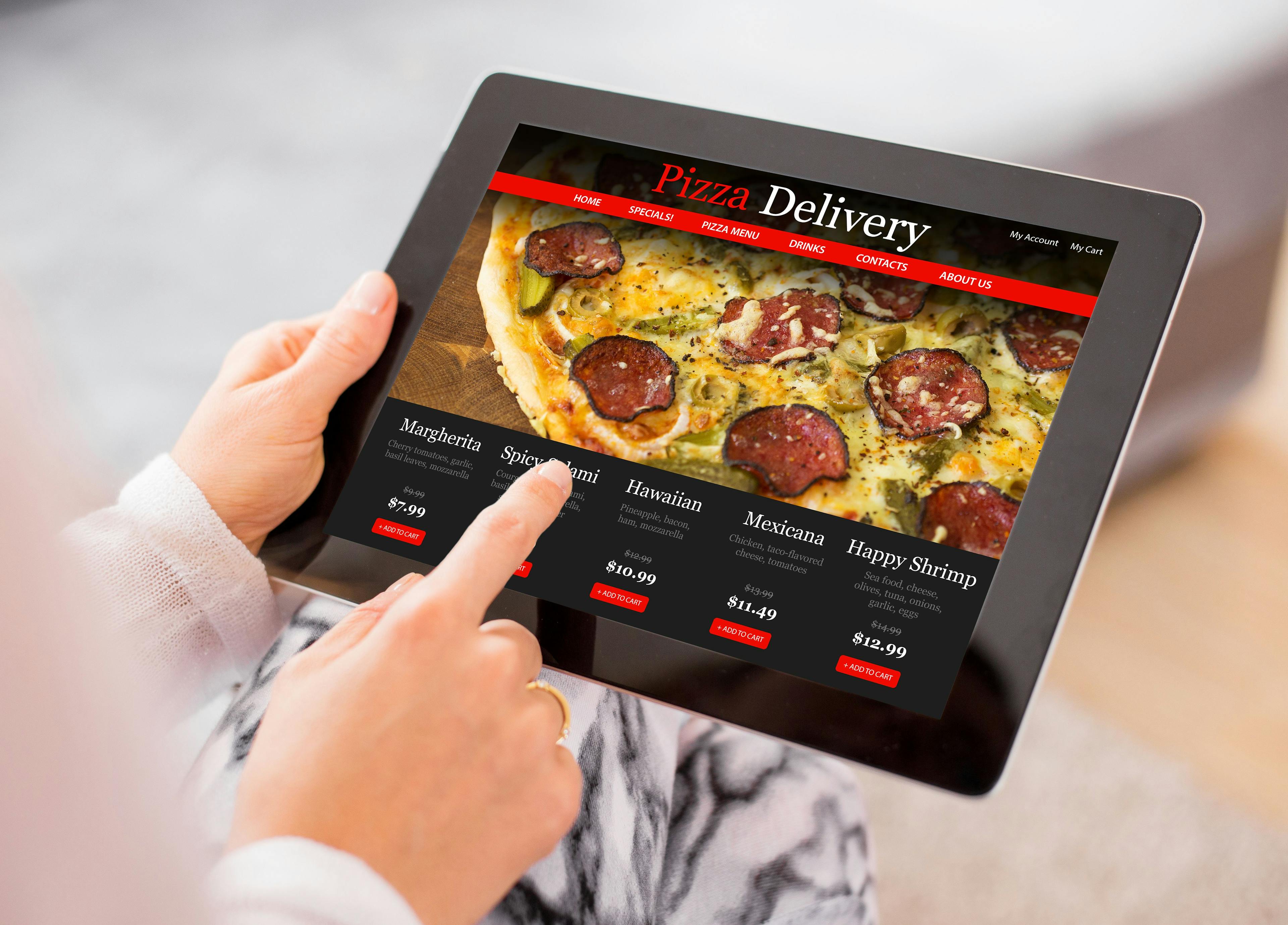 An image of a restaurant delivery website design featuring a tablet menu, making online ordering convenient.