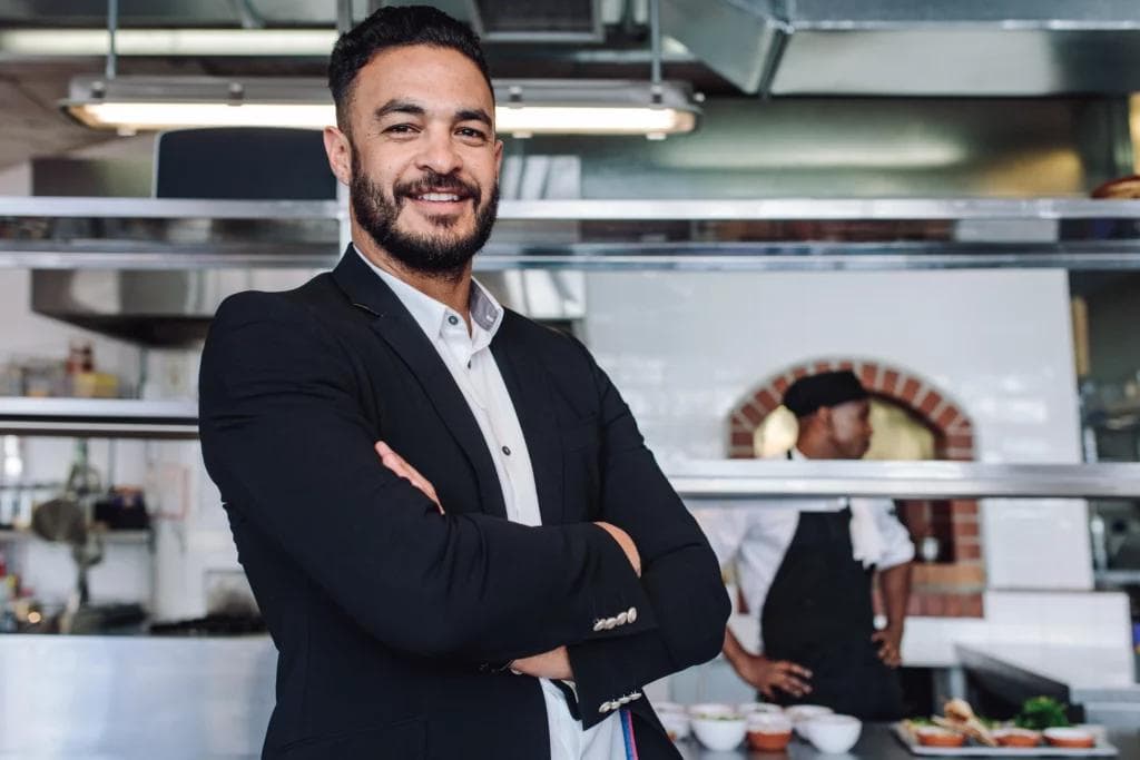 Businessman in kitchen.